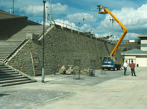 'Passing Through' - repair work on the wall before construction